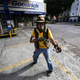 A protestor confronts members of the National Bolivarian Guard